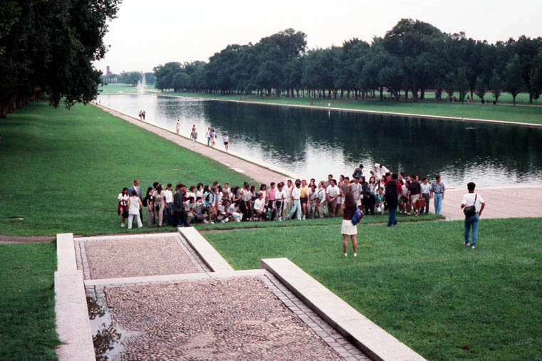Japanese tourists posing in front of the Reflecting Pool in Washington D.C.