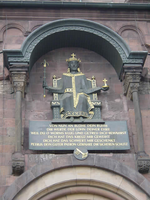 Inscription above the entrace to the Worms cathedral

Von nun an blühe Dein Rum
Dir werde der Lohn Deiner Ehre
weil Du O Worm klug und getreu Dich bewahrst
DIch hat das Kreuz mir geweiht
Dich hat das Schwert mir geschenkt
Petrus Dein guter Patron gewähre Dir Sicheren Schutz