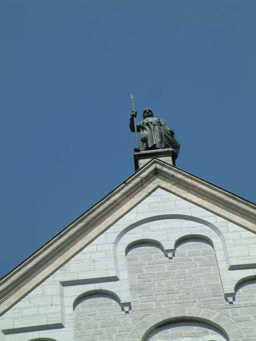 A bronze soldier is keeping watch on the roof of Castle Neuschwanstein