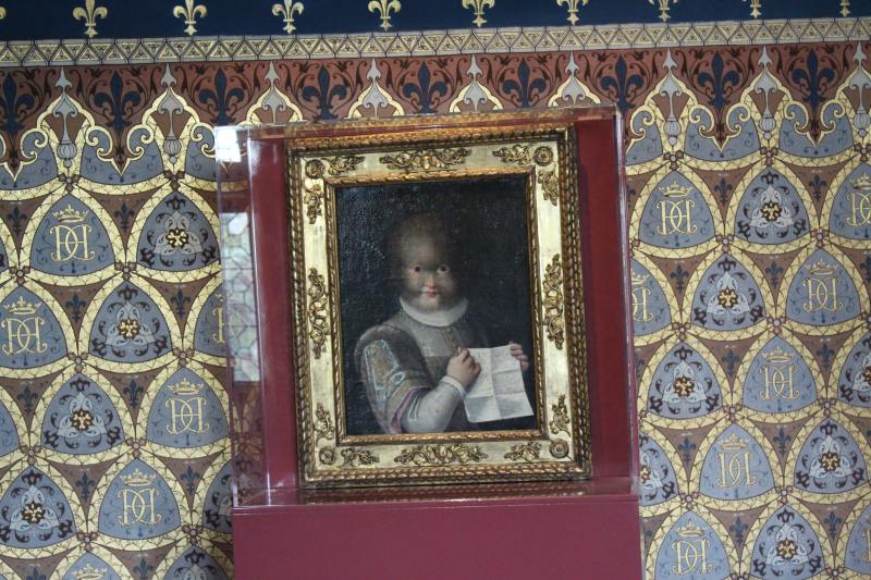 Portait of a small girl with a furry face shown in the Queen's Gallery