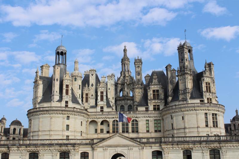 The elaborately developed roof line. It should be noted that the keep's façade is deliberately asymmetrical, with the exception of the Northwest façade, latterly revised, when the two wings were added to the château.