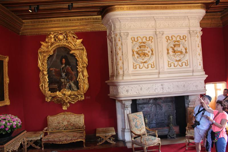 Louis XIV Living Room. Left of the fireplace is a portrait of the king.