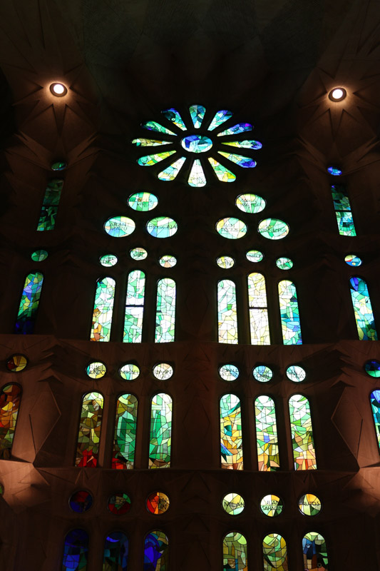 Light coming through& the colorful windows of the basilica