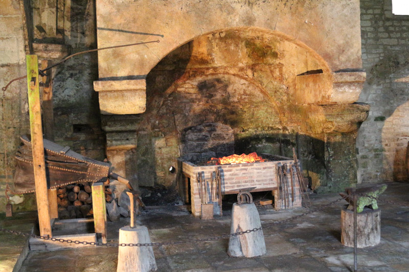Forge fireplace and anvil in the furnaces room