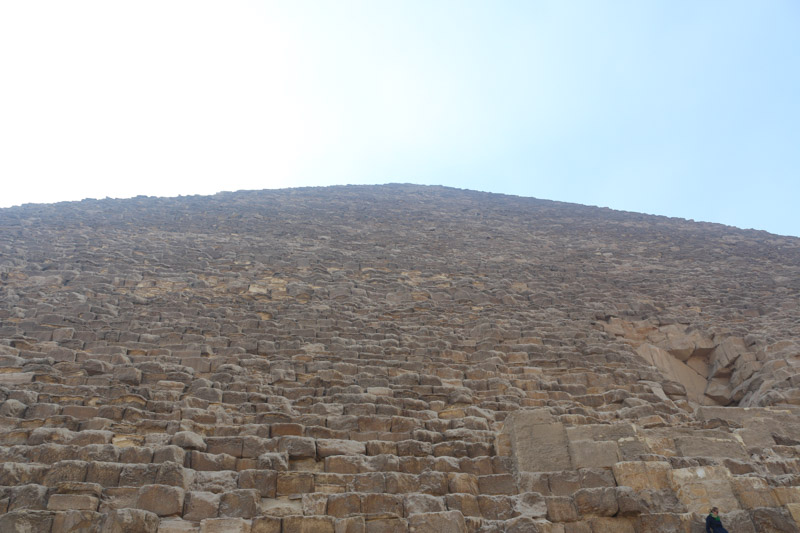 It is thought that, at construction, the Great Pyramid was originally 280 Egyptian cubits tall (146.5 metres (480.6 ft)), but with erosion and absence of its pyramidion, its present height is 138.8 metres (455.4 ft). Each base side was 440 cubits, 230.4 metres (755.9 ft) long. The mass of the pyramid is estimated at 5.9 million tonnes.