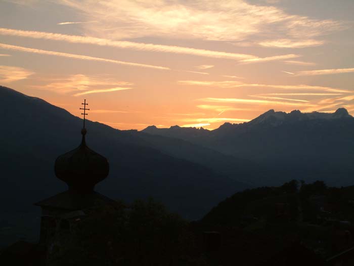 View during sunset from& the village of Triesenberg over the Rhine Valley and the Swiss Alps
