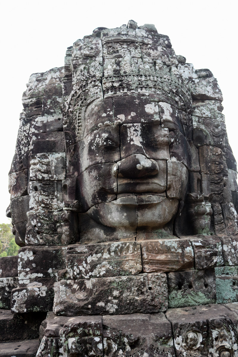 The Bayon's most distinctive feature is the multitude of serene and massive stone faces on the many towers which jut out from the upper terrace and cluster around its central peak.