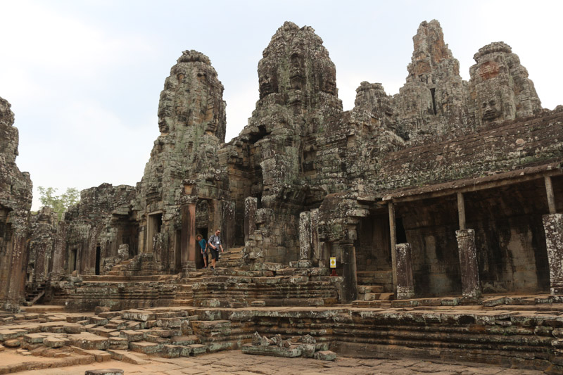 The Bayon's most distinctive feature is the multitude of serene and massive stone faces on the many towers which jut out from the upper terrace and cluster around its central peak.