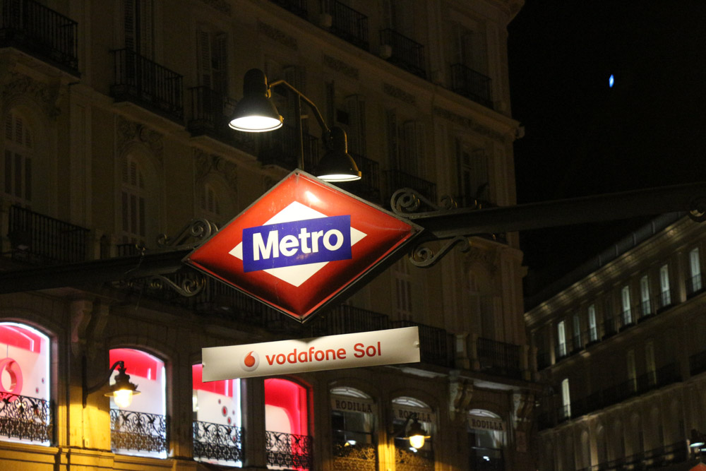 Sol metro sign at night on Plaza de la Puerta del Sol