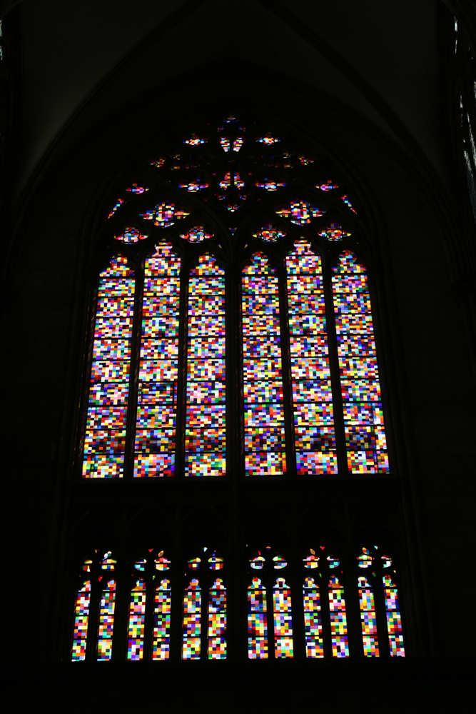 On 25 August 2007, the cathedral received a new stained glass in the south transept window. With 113 m² (1,220 sq ft) of glass, the window was created by the German artist Gerhard Richter. It is composed of 11,263 identically sized pieces of colored glass resembling pixels, randomly arranged by computer, which create a colorful "carpet".