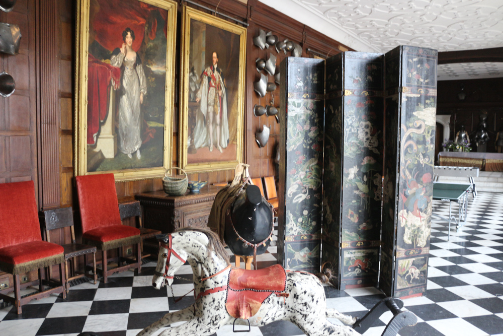 A modern table tennis table is hiding behind a chinese wall in the armory of Hatfield House