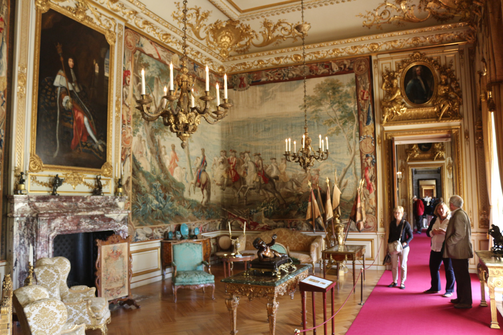 Second State Room in the enfilade of rooms west of the dining hall of Blenheim Palace. The tapestries commemorate the siege of Bouchain and the victory of the 1st Duke of Marlborough. A portrait of the Dike's adversary, Sun King Louis XIV hangs above the fireplace.