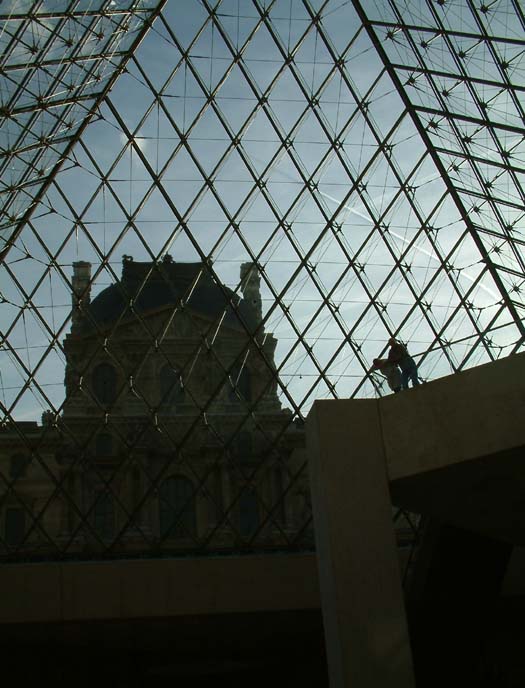 View through the glass pyramid in the middle of the Louvre