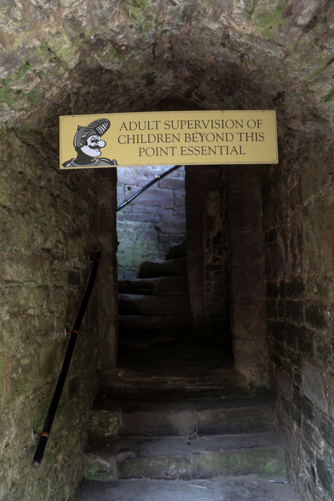 Sign saying "adult supervision of children beyond this point essential". This leads to the stairs up to the top of the Great Tower.