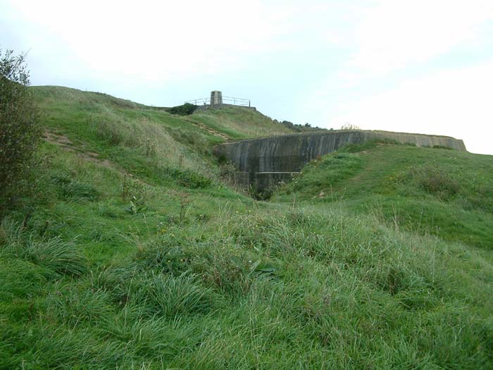 View to Strong Point WN 62 (Stützpunkt WN 62) above Omaha Beach. It was one of the most armoured strong points along the shoreline of the American sector. The picture shows one of two bunkers equipped with 7,55cm field cannons covering most of the beach.