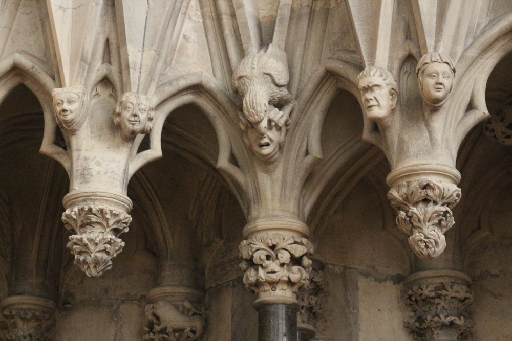 The gothic chapter house of York Minster in decorated with hundreds of small stone heads showing all kinds of facial expressions