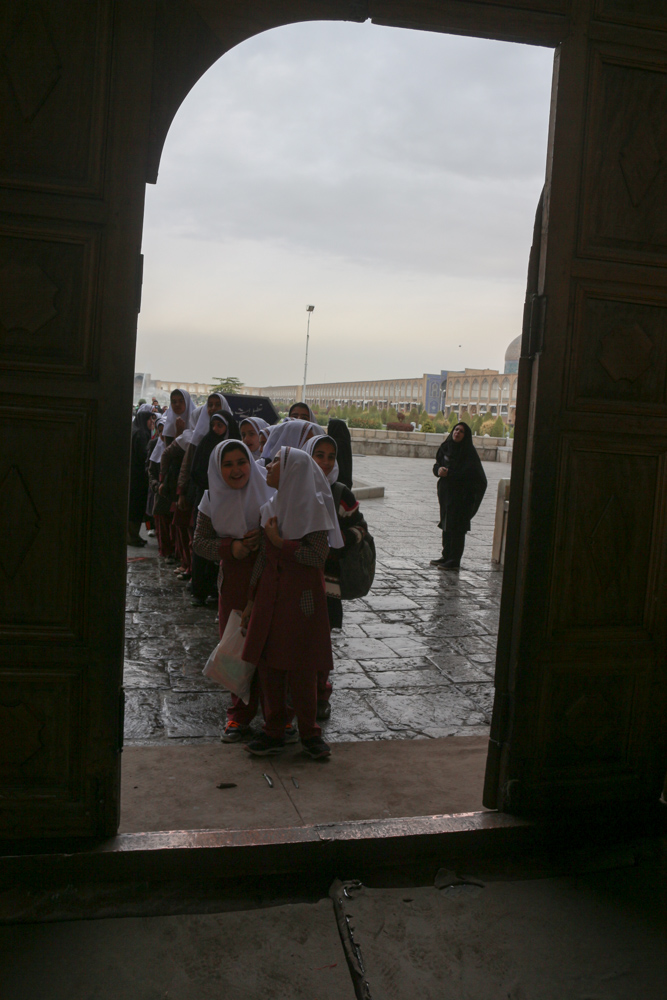 School children are waiting for the beginning of their tour through Masjed-e Shah (Shah Mosque) of Isfahan