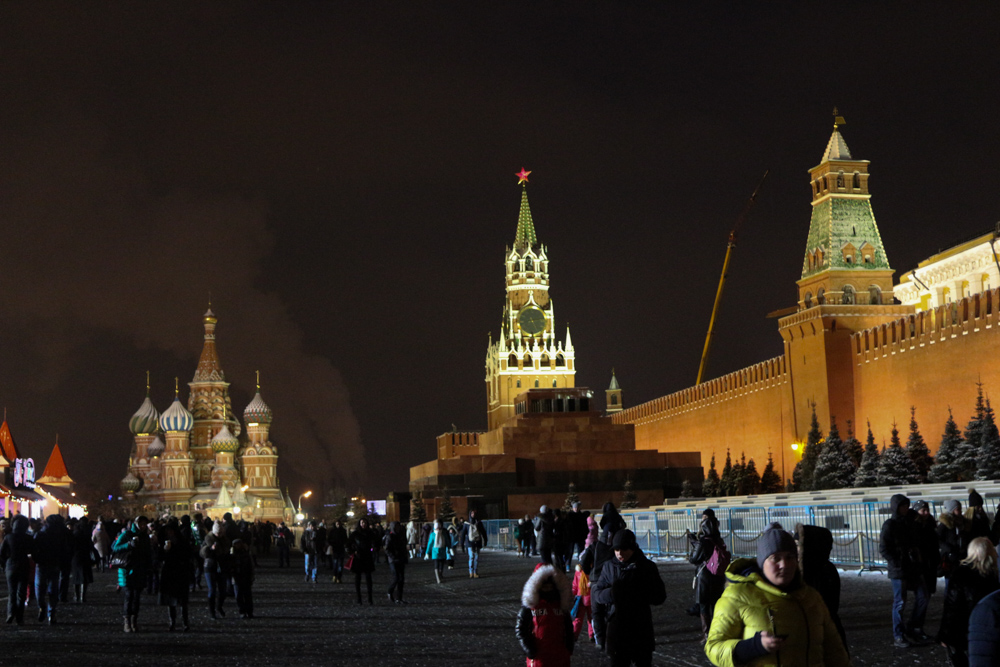 Red square at night with the Kremlin wall and the cathedral under completely dark skies