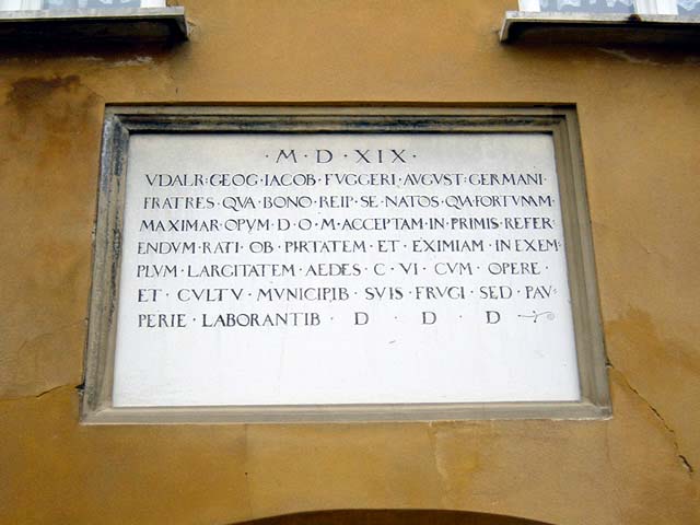 Sign above the entrance of the Fuggerei