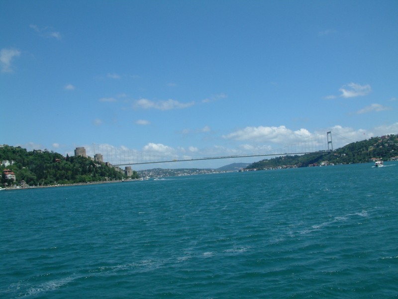 The Fatih Sultan Bridge, also known as the Second Bosporus Bridge (in Turkish: Fatih Sultan Mehmet Köprüsü or 2. Boğaziçi Köprüsü), is a bridge in Istanbul, Turkey spanning the Bosporus strait (Turkish: Boğaziçi). The bridge is situated between Hisarüstü (European side) and Kavacık (Asian side). It is a gravity-anchored suspension bridge with steel pylons and inclined hangers. The aerodynamic deck is hanging on double vertical steel cables. It is 1,510 m long with a deck width of 39 m. The distance between the towers (main span) is 1,090 m (World rank 2004: 11th) and their height over road level is 105 m.