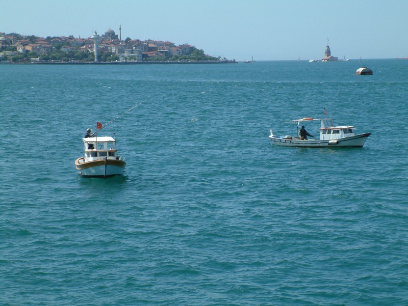 Small fishing boats on the Bosporus strain