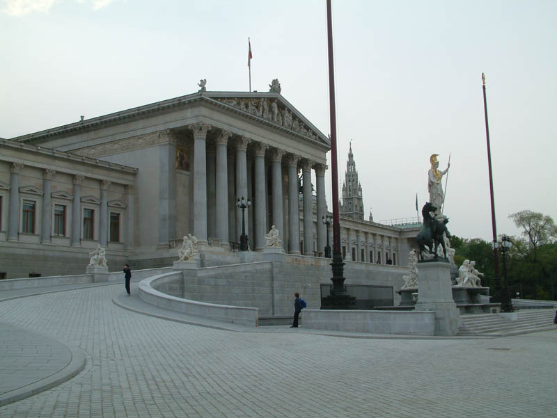 Parliament of Austria with Nationalrat and Bundesrat. In the forground, a fountain with the statue of Pallas Athena.