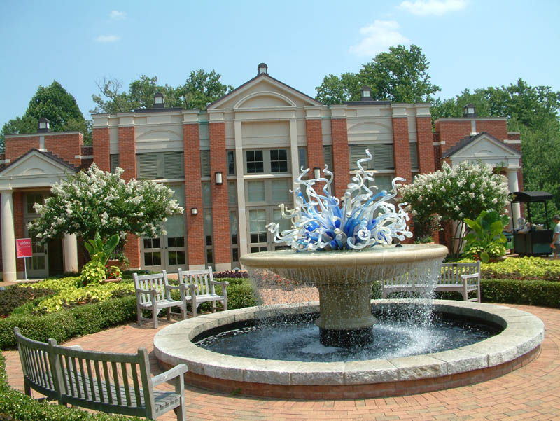 Parterre Garden before the Exhibit Hall with a glass scuplture by Dale Chihuly in the Atlanta Botanical Garden