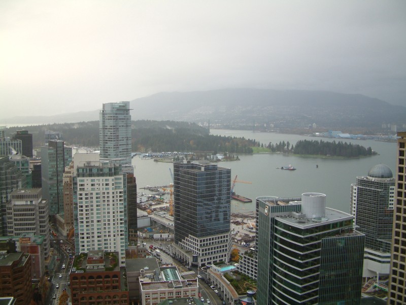 View from "Vancouver Lookout!" on top of the Harbour Centre Tower. Behind the high-rise buildings you can see Coal Harbor in front of Stanley Park.