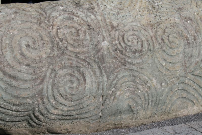 Closeup view of the megalithic carvings on this kerbstone lying at the entrance of Newgrange