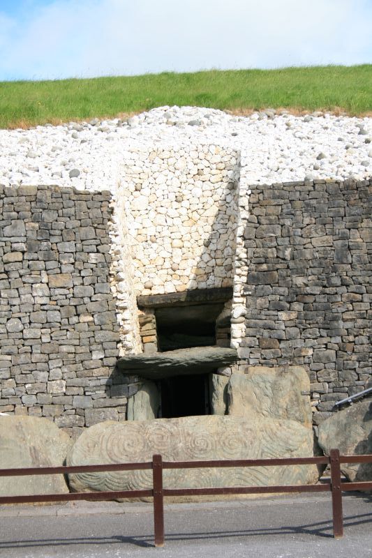 Entrance to Newgrange with megalithic art on the massive kerbstones
