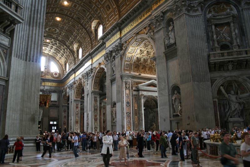 View from the right transept of St. Peter's Basilica to the main entrance. Above you can the arches of the central nave.