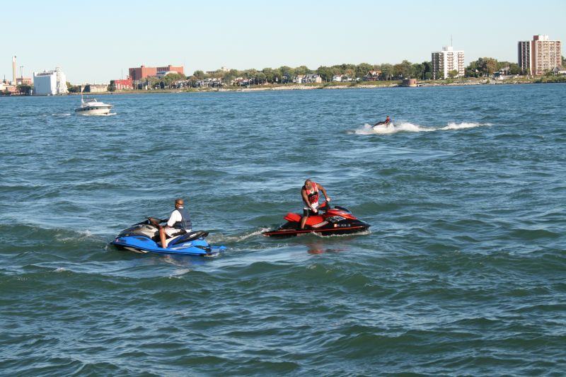 Two jet-ski on Detroit River nearby the Renaissance Center