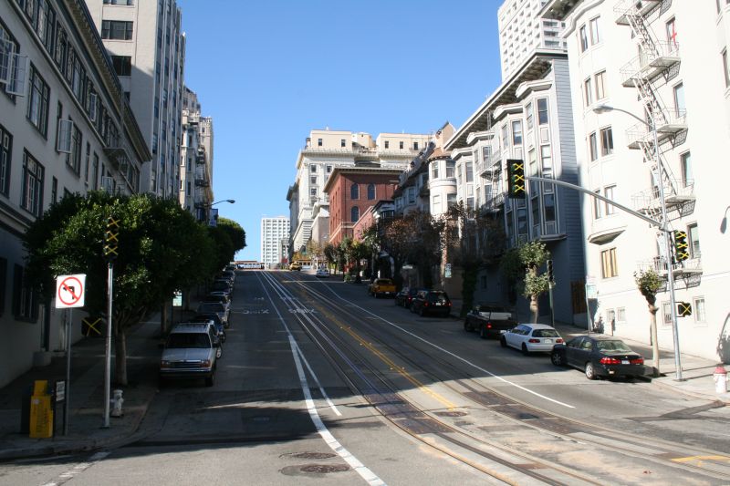 View from Stockton St. up California St. with the cable car lines in the middle
