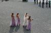A young bride and her bridesmaids taking pictures near Ross Castle on the shore lake Lough Leane.