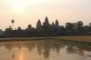View over the (not so) reflecting pool towards the main temples of Angkor Wat during sunset.