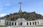 Front of the underground Valle de los Caídos basilica with the giant cross above the granite rock