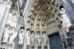 Gothic statues and decorations above the main entrance of Cologne Cathedral