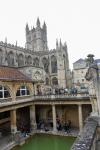 Main pool of the ancient Roman bath with the Bath Abbey in the background
