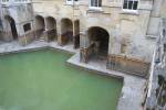 The water of the hot spring surfaces in this ancient pool of the Roman Bath