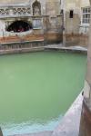 The water of the hot spring surfaces in this ancient pool of the Roman Bath