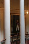 Painting of Napoleon hidden behind one of the columns of the oval staircase
