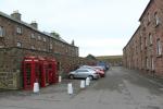 Barracks and British red telephone booths in the center of Fort George