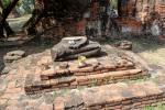Small shrine in front of the remains of Buddha statue in Wat Phra Si Sanphet