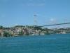 The Fatih Sultan Bridge, also known as the Second Bosporus Bridge (in Turkish: Fatih Sultan Mehmet Köprüsü or 2. Boğaziçi Köprüsü), is a bridge in Istanbul, Turkey spanning the Bosporus strait (Turkish: Boğaziçi). The bridge is situated between Hisarüstü (European side) and Kavacık (Asian side). It is a gravity-anchored suspension bridge with steel pylons and inclined hangers. The aerodynamic deck is hanging on double vertical steel cables. It is 1,510 m long with a deck width of 39 m. The distance between the towers (main span) is 1,090 m (World rank 2004: 11th) and their height over road level is 105 m.