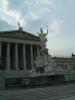 Parliament of Austria with Nationalrat and Bundesrat. In the forground, a fountain with the statue of Pallas Athena.