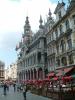 The Grand Place (French: Grand'Place or Grand Place, Dutch: Grote Markt) is the central market square of Brussels. It is surrounded by guild houses, the city's spectacular Town Hall and the Breadhouse (Dutch: Broodhuis, French: Maison du Roi).