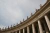 St. Peter's Square is surrounded by an elliptical colonnade with two pairs of Doric columns which form its breadth, each bearing Ionic entablatures. The colonnade wraps around the square, embracing the faithful in "the motherly arms of the church"